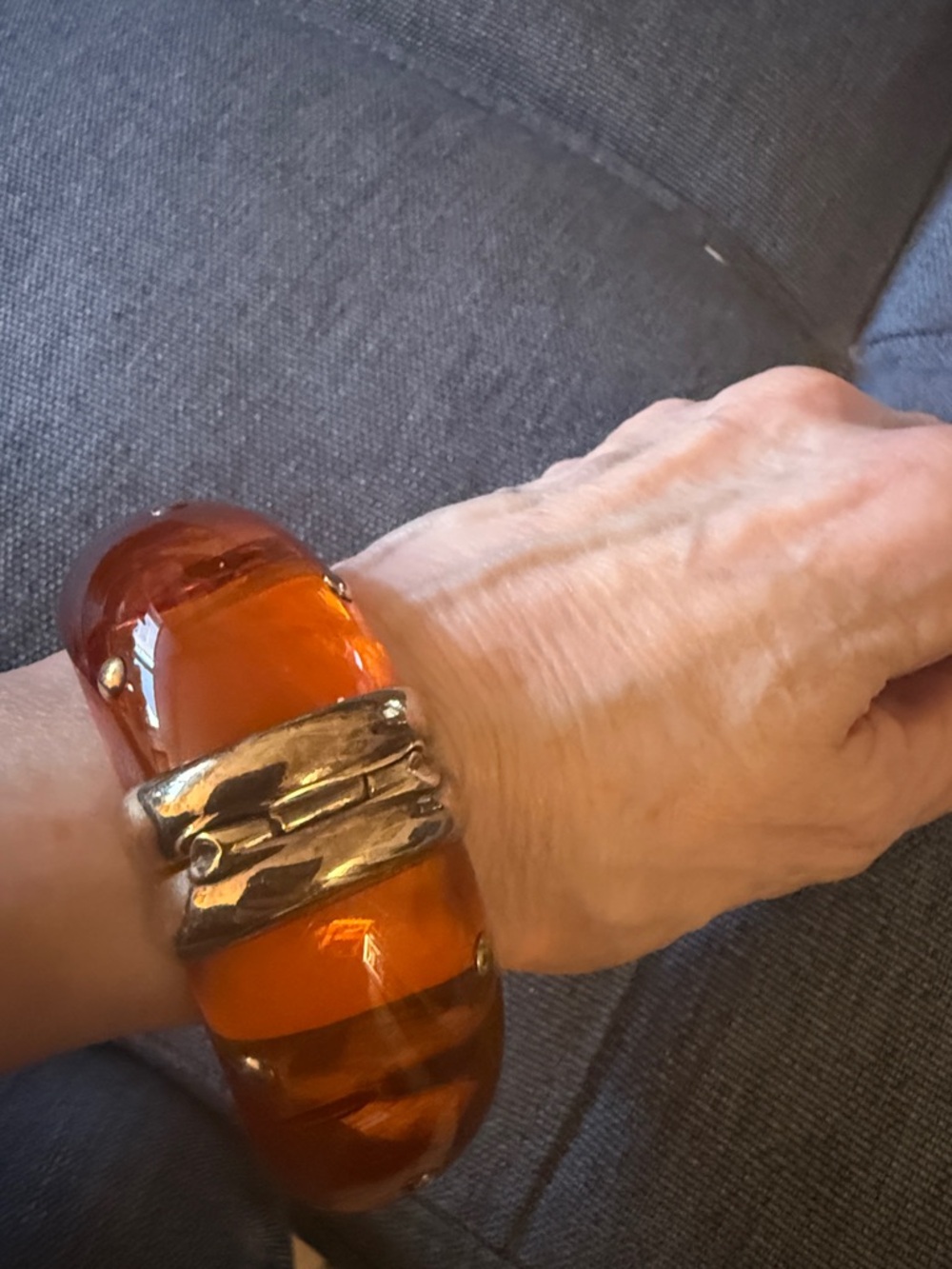 Hinged Studded Resin Bangle Bracelet Featuring a Translucent Amber Color. - Picture 3 of 5